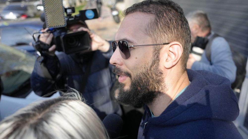 Influencer Andrew Tate briefly leaves house arrest for questioning